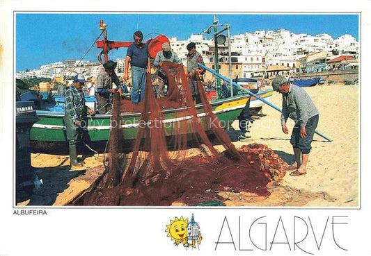 74003274 Albufeira PT Fisherman with boat and nets on the beach