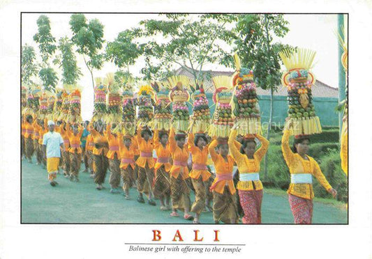 74026431 Bali  Indonesia Balinese girl with offering to the temple