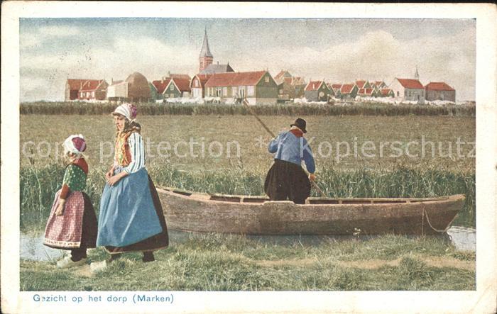 11761445 Marken Gezicht op het dorp waterway boat traditional costumes