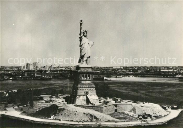 73590461 New York City Statue of Liberty in front of New York Harbour aerial vie