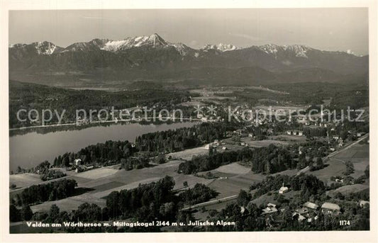 73595690 Velden Woerthersee Fliegeraufnahme mit Mittagskogel und Julische Alpen