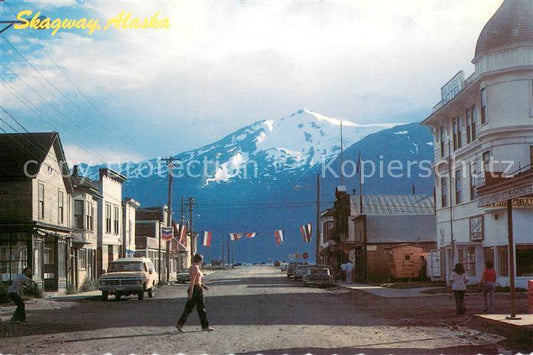 73716749 Skagway Alaska Old buildings line Broadway Mountains